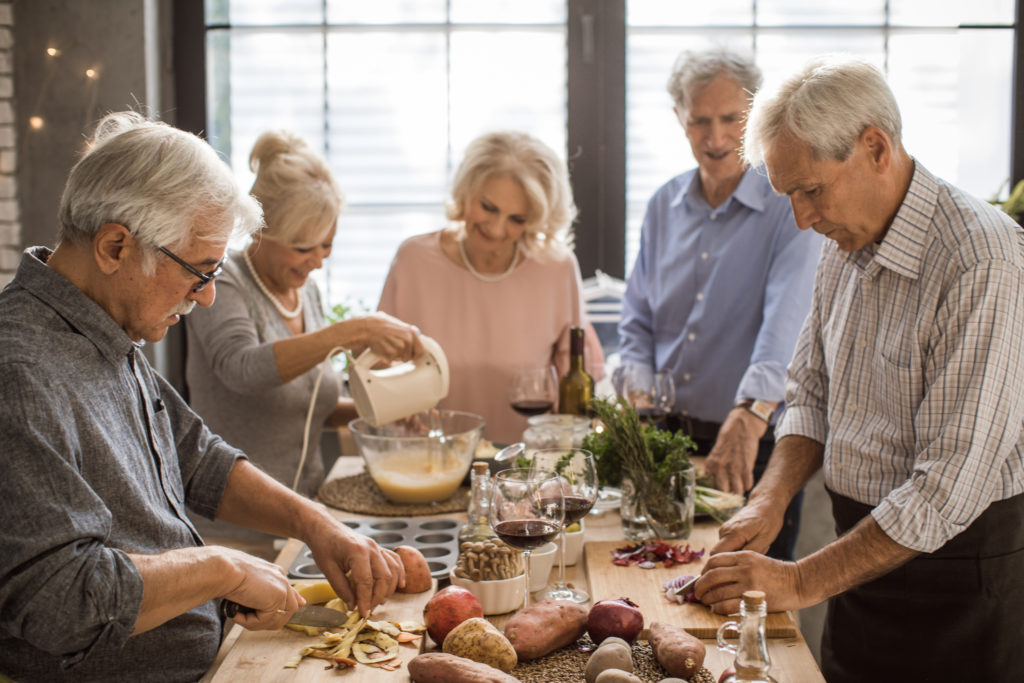 Senior adult people make Christmas dinner and enjoy in holiday celebration