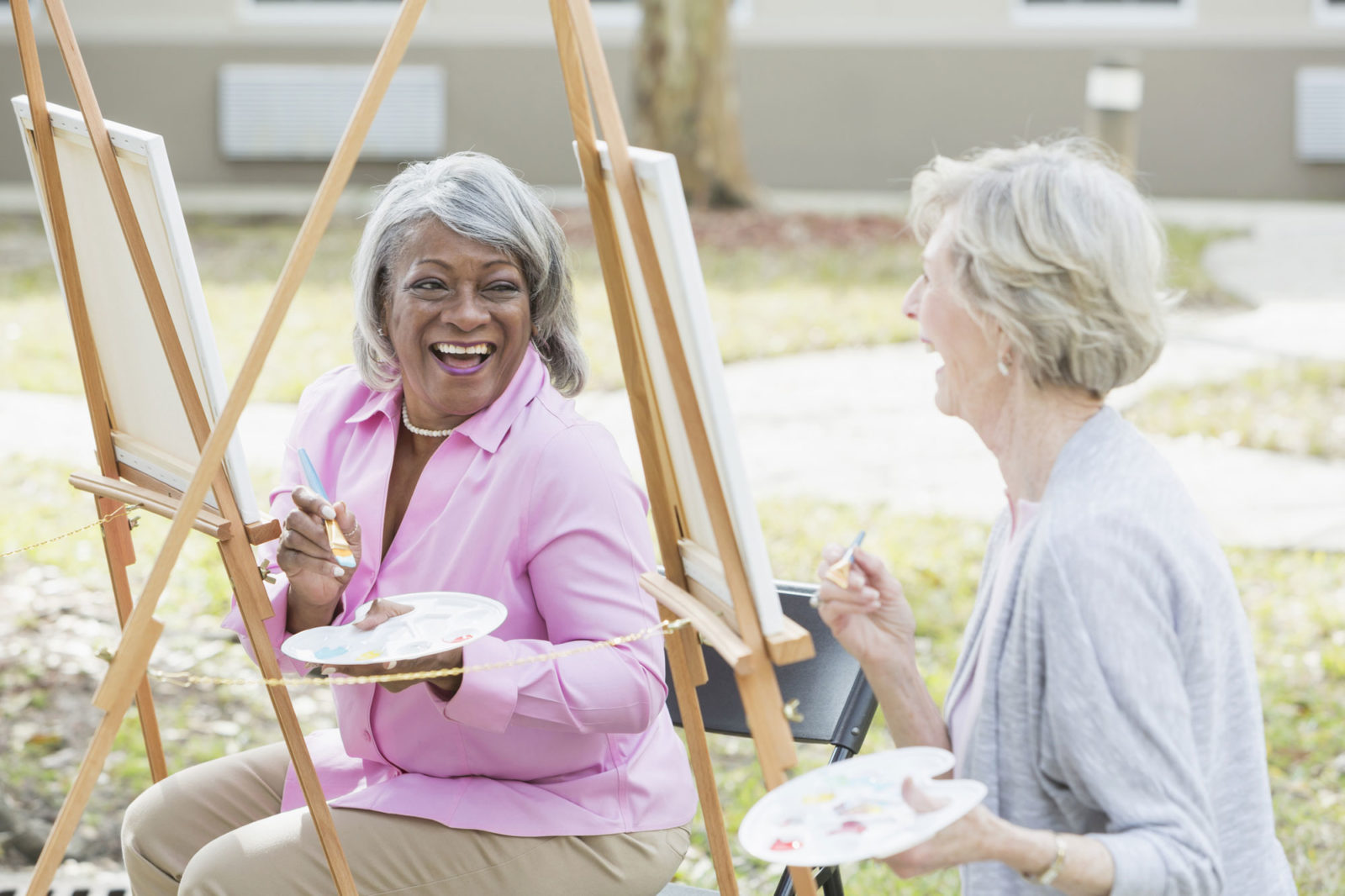 Multi-ethnic senior women taking an art class