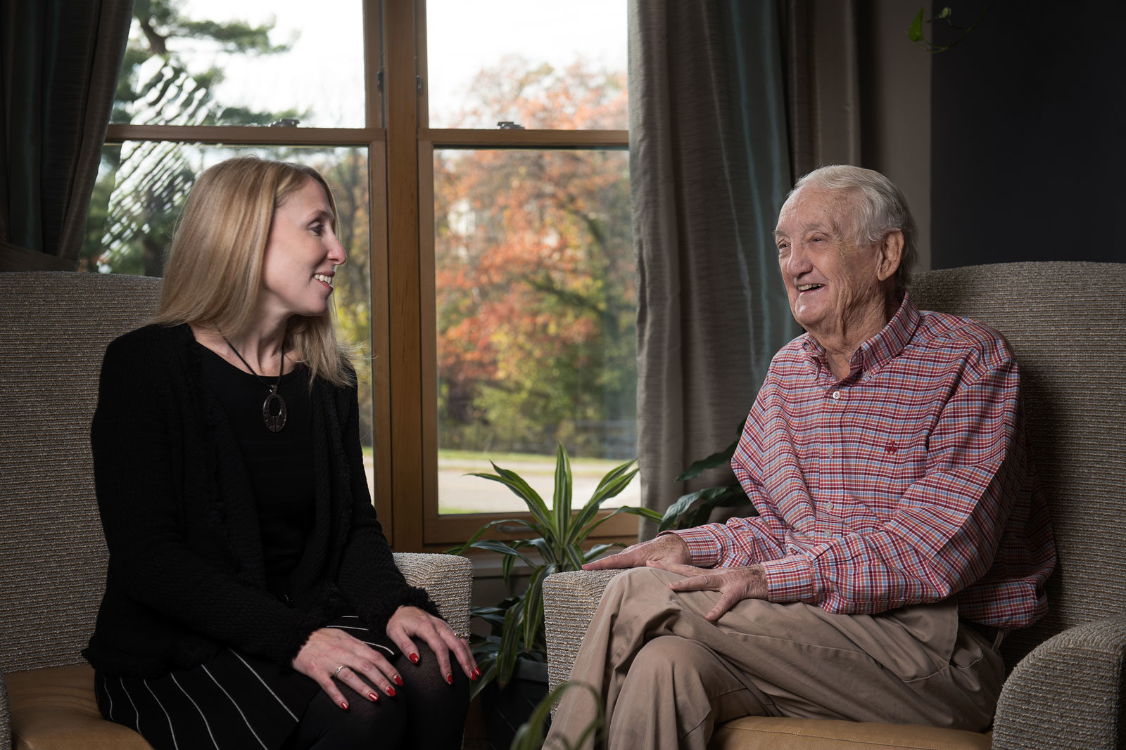 Caremanager talking elderly man