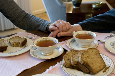holding hands and having tea