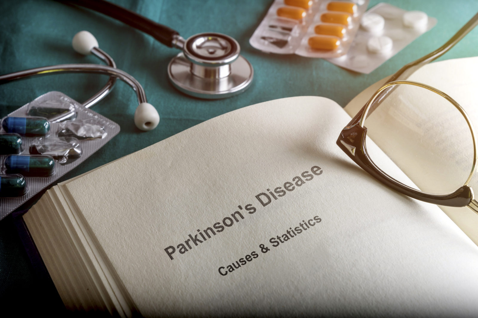 a medical book opened to a chapter on Parkinson's disease