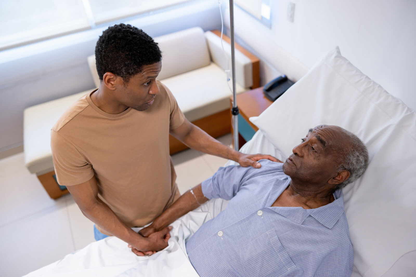 Black man visiting his father at the hospital