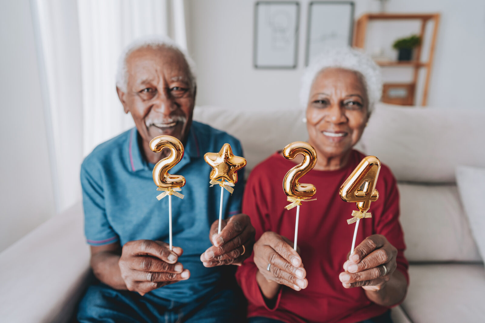 Senior couple holding number 2024